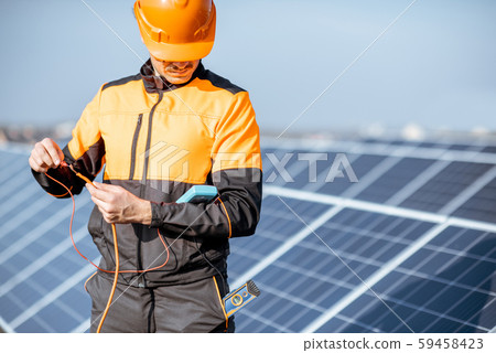 Electrician working on a solar station Electrician working on a solar station 59458423