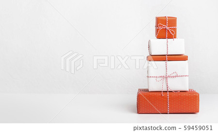 Christmas presents wrapped in recycled paper on white Christmas presents wrapped in recycled paper on white 59459051