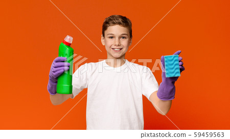 Teenager in protective gloves holding sponge and bottle with detergent 59459563