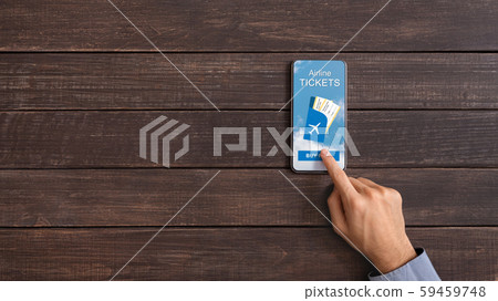 Man downloading application for booking airline tickets online on smartphone Man downloading application for booking airline tickets online on smartphone 59459748