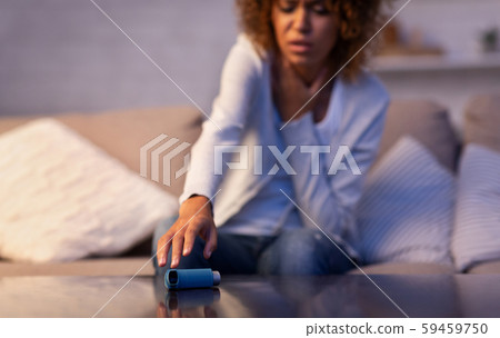 Asmathic girl catching inhaler having asthma attack Asmathic girl catching inhaler having asthma attack 59459750