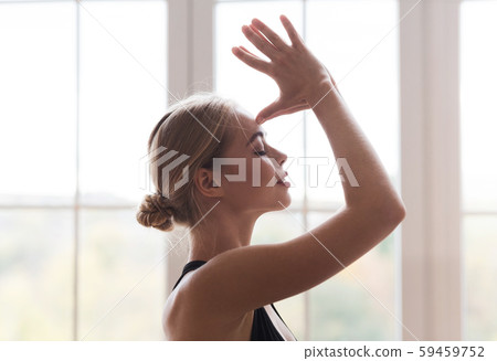 Portrait of peaceful girl practicing yoga at home Portrait of peaceful girl practicing yoga at home 59459752