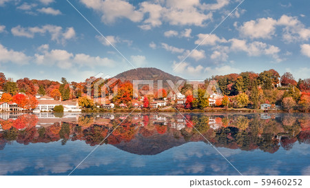 Fall Landscape showing Lake houses with reflections in Lake Junaluska 59460252