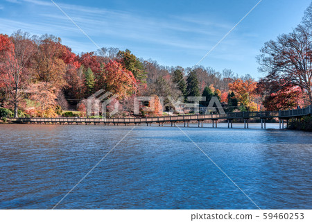Fall Landscape showing Lake houses with reflections in Lake Junaluska 59460253