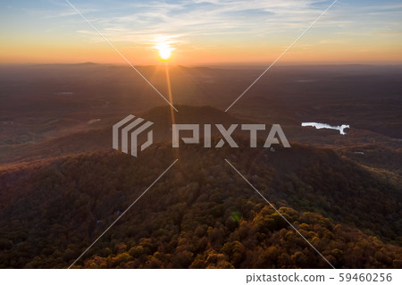 Aerial dramatic panorama sunset with sun rays in Jasper during the fall. Created from 9 images Aerial dramatic panorama sunset with sun rays in Jasper during the fall. Created from 9 images 59460256
