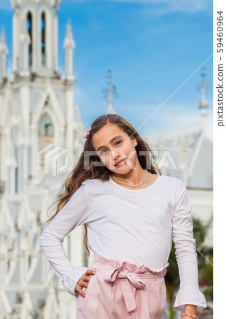 Girl at the River Boulevard in front of the famous gothic church of La Ermita in Cali Girl at the River Boulevard in front of the famous gothic church of La Ermita in Cali 59460964