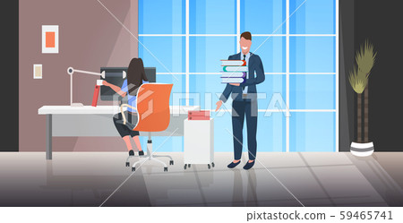 boss giving documents stack to overworked female worker deadline paperwork concept modern office boss giving documents stack to overworked female worker deadline paperwork concept modern office 59465741