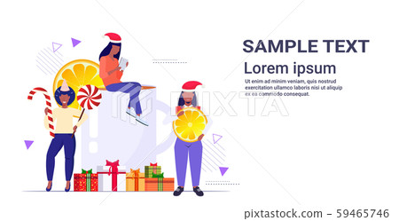 people near christmas drink mulled wine holding candy cane lollipop and orange slice winter holidays people near christmas drink mulled wine holding candy cane lollipop and orange slice winter holidays 59465746