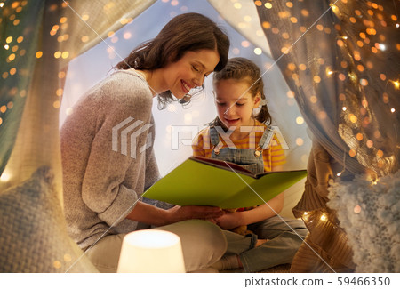 happy family reading book in kids tent at home happy family reading book in kids tent at home 59466350