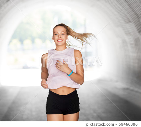 happy teenage girl running outdoors happy teenage girl running outdoors 59466396