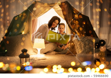 happy family reading book in kids tent at home happy family reading book in kids tent at home 59466690