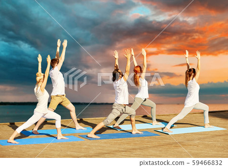 group of people making yoga exercises outdoors group of people making yoga exercises outdoors 59466832