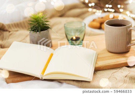 diary, tea and candle in holder at home diary, tea and candle in holder at home 59466833