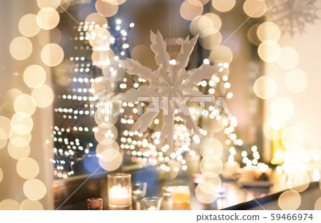 paper snowflake decoration hanging on window 59466974