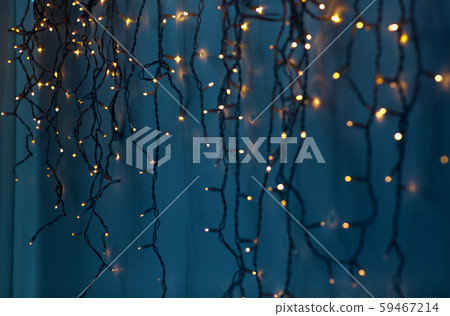 christmas garland lights over dark blue background christmas garland lights over dark blue background 59467214