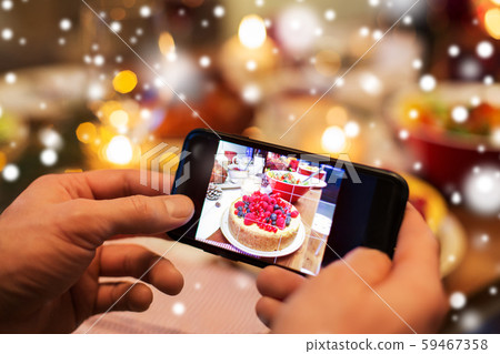 hands photographing food at christmas dinner hands photographing food at christmas dinner 59467358