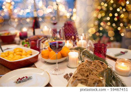 glass of red wine and food on christmas table glass of red wine and food on christmas table 59467451
