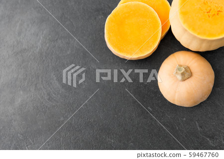 cut pumpkin on stone background cut pumpkin on stone background 59467760