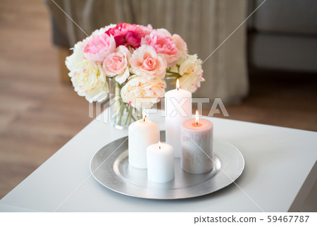 candles burning on table and flowers at cozy home candles burning on table and flowers at cozy home 59467787