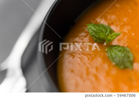 close up of vegetable pumpkin cream soup in bowl 59467806