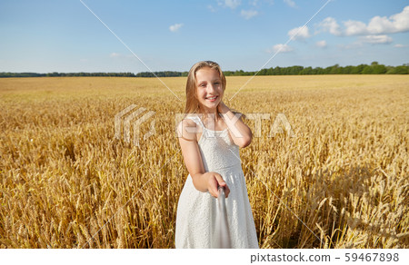 happy girl taking selfie on cereal field happy girl taking selfie on cereal field 59467898