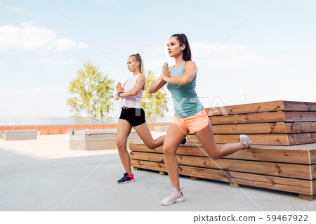 women training and doing split squats women training and doing split squats 59467922