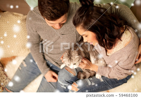 happy couple with cat at home happy couple with cat at home 59468100