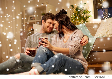 happy couple drinking coffee and eating at home happy couple drinking coffee and eating at home 59468102