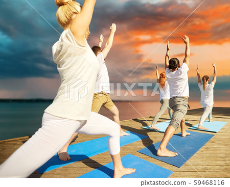 group of people making yoga exercises outdoors group of people making yoga exercises outdoors 59468116