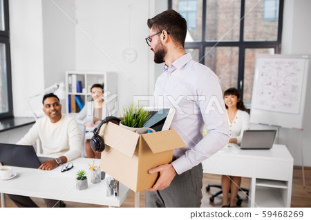 happy male office worker with personal stuff happy male office worker with personal stuff 59468269