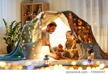 happy family playing with toy in kids tent at home happy family playing with toy in kids tent at home 59468397