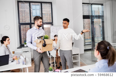 executive seeing off sad fired male office worker 59468612