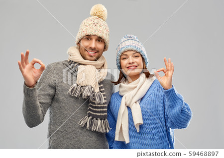happy couple in winter clothes showing ok sign happy couple in winter clothes showing ok sign 59468897