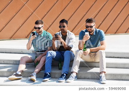 men with smartphones drinking beer on street men with smartphones drinking beer on street 59469098