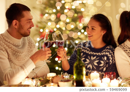 happy couple celebrating christmas at home feast happy couple celebrating christmas at home feast 59469099