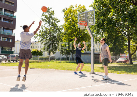 group of male friends playing street basketball group of male friends playing street basketball 59469342