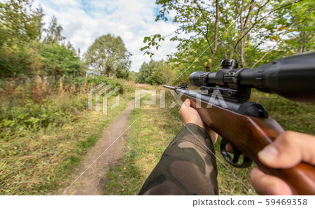 POV of male hands shooting with air rifle POV of male hands shooting with air rifle 59469358