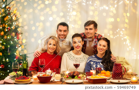 happy friends celebrating christmas at home happy friends celebrating christmas at home 59469749