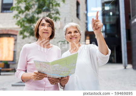 senior women with city map on street in tallinn senior women with city map on street in tallinn 59469895