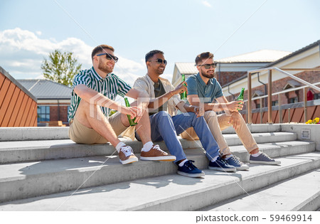 happy male friends drinking beer on street happy male friends drinking beer on street 59469914
