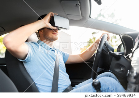 man or driver wearing vr glasses and driving car man or driver wearing vr glasses and driving car 59469934