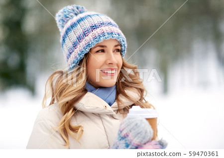happy woman drinking coffee outdoors in winter happy woman drinking coffee outdoors in winter 59470361