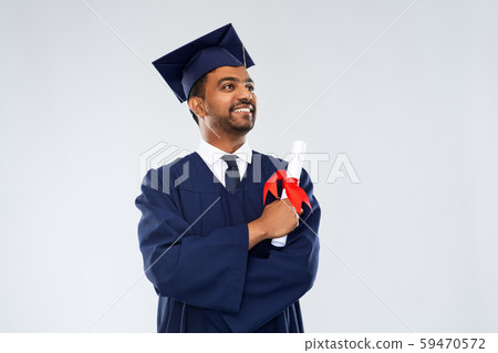male graduate student in mortar board with diploma 59470572