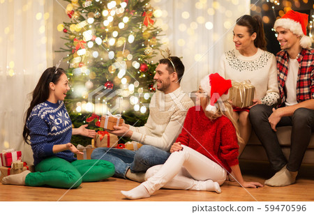 friends celebrating christmas and giving presents 59470596