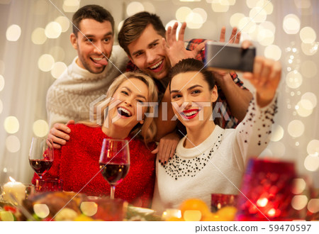 friends taking selfie at christmas dinner friends taking selfie at christmas dinner 59470597
