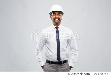 indian male architect in helmet over grey 59470944