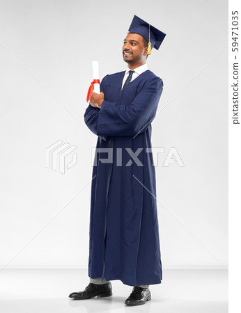 male graduate student in mortar board with diploma 59471035