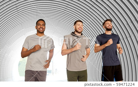 young men or male friends running in tunnel 59471224