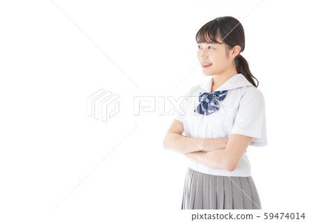 Female student in uniform with arms crossed 59474014