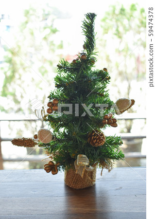 christmas ornament decoration on small green pine 59474378